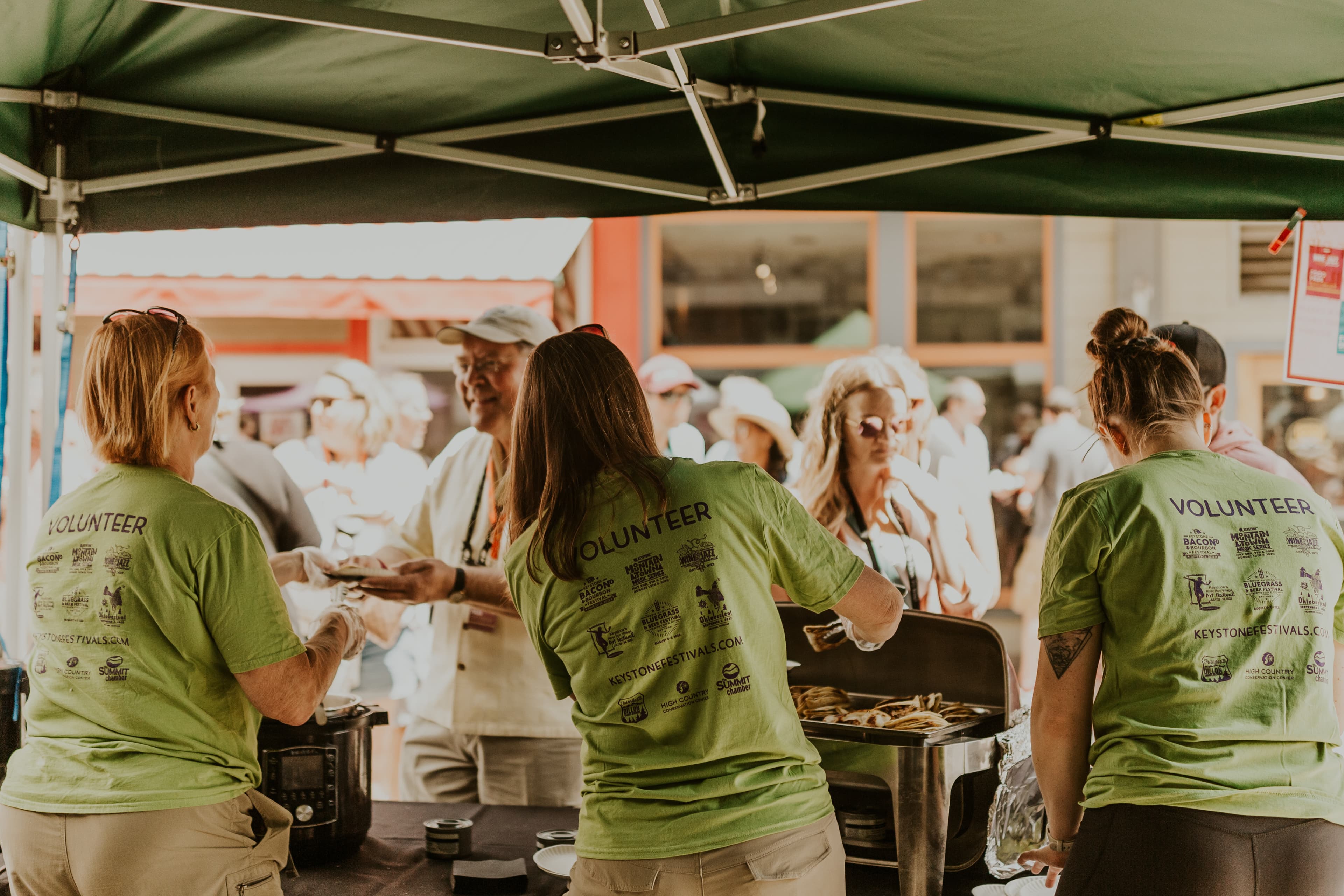 Volunteers in branded gear at an event
