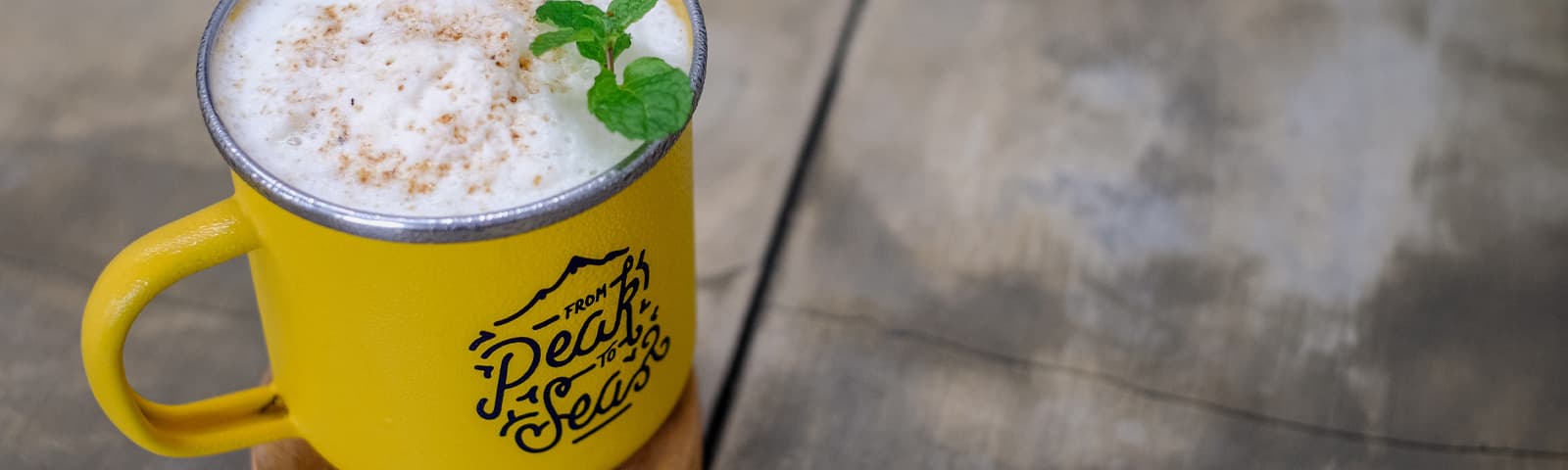 Hands pulling bright ink over a printing screen